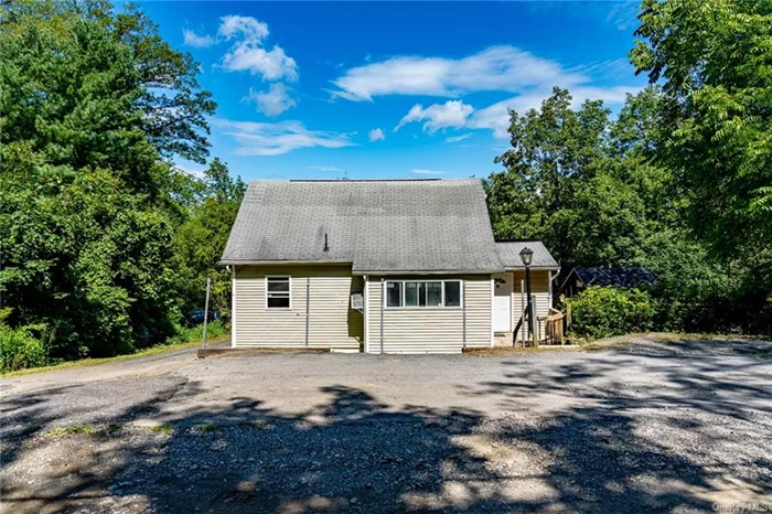 Welcome to this charming 3-bedroom, 1-bath home built in 1955 is nicely nestled on the shoulder of Schunnermunk Mountain in Monroe, NY. This property is situated on a large 6, 499 sq ft lot, offering privacy and a strong connection to nature. As you step inside, you will be greeted by a cozy foyer and a bonus room. The spacious living room seamlessly flows into an oversized kitchen, perfect for entertaining guests or simply unwinding at the end of the day. The dormered oversized upstairs room serves as a wonderful master suite, complete with its own heating zone and ample storage/closet space. There is ample parking with a double carport in front of the home, and a private driveway leading to a private garage. The property also boasts its own well for year-round water supply. Community amenities, such as a playground and basketball courts that are located just down the road. Included is an additional 1000 sq. ft lot Tax ID# 332089.033.000-0001-061.000/0000 (located on the left hand side of the property). Don&rsquo;t pass up the chance to own this affordable mountain hideaway!