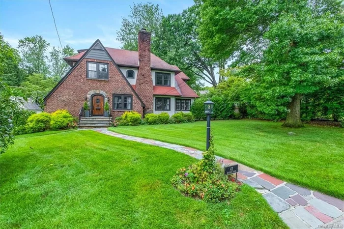 Bright English in sought after in-town Scarsdale neighborhood, walk to schools, parks, village, as well as public transportation. This pristine home delivers a wonderful layout with entry foyer, grand living room/fireplace w/special cozy seating area to enjoy that special book, large dining room w/walls of windows, dr to private patio for summer entertaining, fabulous chef&rsquo;s MEIK/stainless steel appliances w/adjoining family room and first floor guest powder room. Second floor offers a large primary bedroom w/ensuite spa bath w/soaking tub, separate stall shower and dual sink vanity, plus 3 additional bedrooms and hall bath. On the third floor is a private guest bedroom suite/2nd fridge and adj. full bath. Lower level has plenty of space for fun, as well as a laundry room and att. 2 car garage w/Tesla charging station. Come and enjoy all that Scarsdale has to offer: award-winning schools, 32 minute express train to NYC, newly renovated public library, swimming pool and tennis and pickleball courts. Welcome home!