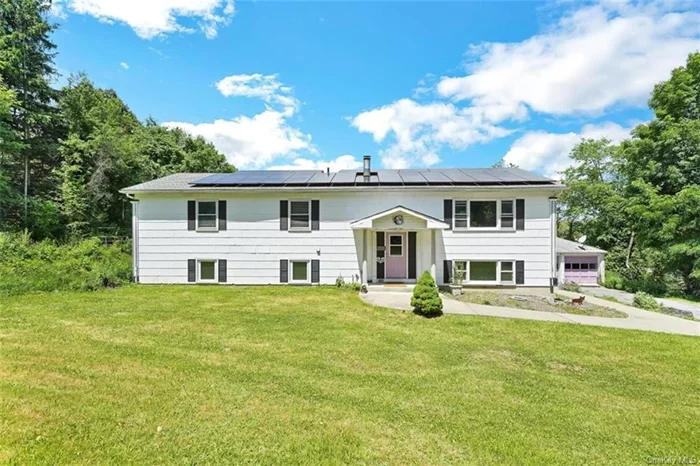 Step into traditional lifestyle living in this stunning Warwick residence. Upon entry, a grand open-concept staircase leads to a spacious family room, bright kitchen, and formal dining room. Enjoy outdoor dining on the large covered deck while keeping an eye on your animals. Down the hall, you&rsquo;ll find 4 generously sized bedrooms, including a master bedroom with an updated ensuite bathroom and a full room currently used as a master walk-in closet! The lower level is the heart of the home, featuring an open-concept bar and a secondary kitchen. Relax in front of the pellet stove while enjoying hot or cold drinks. The lower level also houses 3 additional bedrooms, one with a private full bathroom. Step out to the beautiful 5.6-acre property where you can pick apples, peaches, pears, and enjoy natural spring water. Additionally, there&rsquo;s a spacious detached garage with 2 overhead doors, accommodating 6+ cars and featuring a 6-foot-deep mechanic&rsquo;s pit. Accessible from the main road, it&rsquo;s ideal for heavy machinery. The solar panel lease keeps utility costs low, and the layout is suitable for a mother-and-daughter setup with its separate entrance and secondary kitchen downstairs. The price reflects the potential for updates. A recent appraised report values the property at $635, 000. Don&rsquo;t miss out - schedule a tour now!