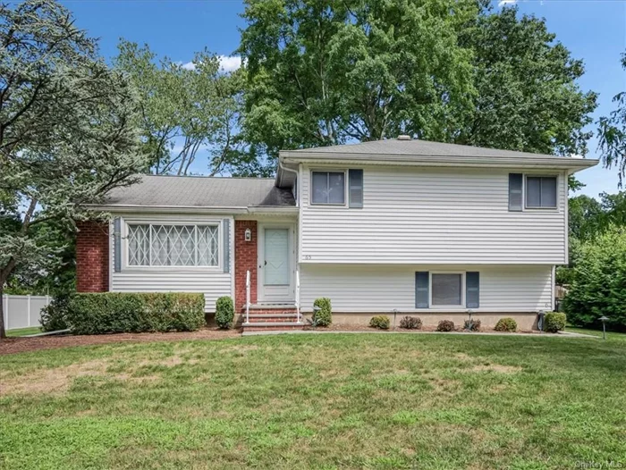 This home is an absolute must-see in Bardonia, NY! Conveniently located in the highly sought-after Clarkstown School District and is in a quiet residential neighborhood near the popular Bardonia Elementary. Clarkstown has been named one of the safest places to live multiple years by money magazine.   This home features three spacious bedrooms with plenty of closet space, renovated 1.5 bathrooms, living room, a formal dining room, eat-in kitchen, family room with new luxurious vinyl plank flooring and basement with a washer and dryer. Central A/C and heating for year-round comfort. Freshly painted walls, large windows and new recessed lighting though out, create a bright and airy ambiance. House has an attached garage with a large driveway easily fitting 4 cars. Step outside to over a third of an acre of flat, level property. The front path and steps are elegantly crafted from slate, complemented by matching walking path to backyard to a charming patio. This house is move in ready!