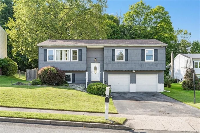 Discover this inviting 4-bedroom, 2.5-bath Bi-Level home in the Village of Monroe, NY, perfectly situated on a quiet cul-de-sac. This beautifully updated residence features a modern kitchen with a farmhouse sink, granite countertops, a 6-burner cooktop, and ample storage space. The main level includes a spacious and bright living room, dining area, and three comfortable bedrooms, including a primary suite with a remodeled bath, and beautifully renovated hall bath. The lower level offers a versatile updated family room, an additional bedroom, and a stylishly updated half-bath. Enjoy outdoor living with a tiered deck spanning the entire back of the house and an above-ground pool, perfect for entertaining. This home blends contemporary upgrades with classic comfort in a serene setting.