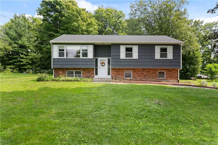 This lovely Raised Ranch is situated on level property, in a quiet neighborhood in the Mahopac School District. Located just a short walk from a scenic golf course, this home also includes coveted lake rights to a beautiful sandy beach and park on the shores of Kirk Lake, providing endless opportunities for relaxation and recreation. The main level features a spacious living room, formal dining room, and eat-in kitchen with direct access to a three-season room and deck, perfect for entertaining or enjoying your morning coffee. The primary bedroom boasts an en-suite full bath with a walk-in shower, accompanied by two additional bedrooms and another full bath. The lower level offers a cozy family room with a pellet stove, perfect for those chilly evenings, along with utilities and garage access. This home truly offers the ideal combination of indoor and outdoor living in a serene setting. Taxes shown do not include Basic STAR deduction, for those who qualify.