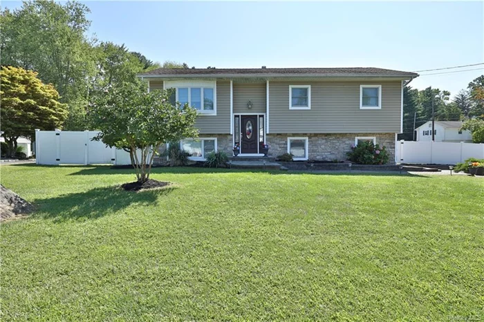 This stunning bilevel home has been beautifully renovated, showcasing an open concept design that maximizes space and natural light. The living area features large windows that invite the outdoors in, enhancing the inviting atmosphere, while the smooth flow between the living room, dining area, and kitchen makes it perfect for entertaining.  The large, private master bedroom is a true sanctuary, boasting impressive cathedral ceilings that add a sense of grandeur and openness. This serene retreat includes ample closet space and is designed for comfort and relaxation. Enjoy your Juliette porch, offering a perfect spot to enjoy morning coffee or evening sunsets while overlooking the lush surroundings.  The kitchen is outfitted with modern appliances and sleek countertops, which seamlessly blend with the stylish design. This bilevel home also offers additional 4 bedrooms and spacious bathrooms, making it an ideal choice for families or anyone who loves to host guests. Overall, this renovated bilevel combines elegance and functionality, providing a luxurious yet cozy living environment.