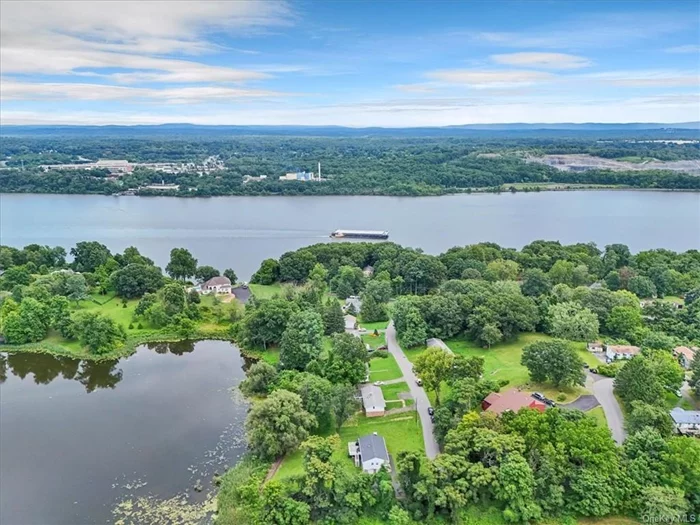 Uncover the charm and endless possibilities with this delightful 3-bedroom, 1.5-bathroom home, positioned serenely by a lake and moments away from the majestic Hudson River. Boasting 1992 sq ft of interior space, the top floor of 1152 sq ft, offers a stunning new kitchen, quartz countertops, nice appliances, a modern-designed bathroom and 1/2 bath, vinyl floors, recessed lighting, and 3 bedrooms. Lower-level features about 840 sq ft, in the finished basement with a big family room, laundry room, and spacious garage. Large yard in the back of the house, facing the lake.