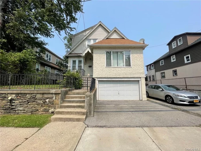 Welcome to this lovely legal two-family home in Yonkers. Sitting on a huge lot, 4792 square feet to be exact, this home is perfect. One-bedroom apartment over a two-bedroom, with another full bathroom in the basement. Cedar closets in the bedrooms. Eat-in kitchen in the one-bedroom apartment. Living room and dining room sharing the same space. The apartment downstairs has a huge kitchen with dining room area, large size living room, spacious bedrooms. Huge outdoor space for all gatherings. Sold as is.