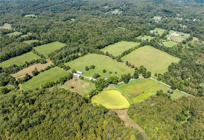 A marvelous opportunity to enjoy the finest in country living in the beautiful Hudson Valley. A picturesque farm in the heart of scenic Dutchess County, this property is a treasure. The circa 1783 house is privately set and is surrounded by approximately 120 acres of productive agricultural land and woodlands. The home, with almost 4000 square feet of living space, has been well cared for. The details throughout exude a warm comfortable feeling; spacious, inviting rooms, 2 fireplaces, and fabulous wide plank flooring. The main level features a living room, formal dining room, cozy office, large country kitchen, mudroom, powder room and a lovely primary bedroom suite. Three additional bedrooms, and a full bath are on the second floor. The house is set well off the road with a wonderful approach. Enjoy views of the mountains from the high point of the property and trails through the woodlands. An idyllic property, complemented by an inground pool, a pond, period barns, fabulous stonewalls and tree lined meadows. Convenient location, close to commuter routes, the Metro North station, and a short drive to the charming villages of Millbrook and Rhinebeck. 90 minutes from NYC!