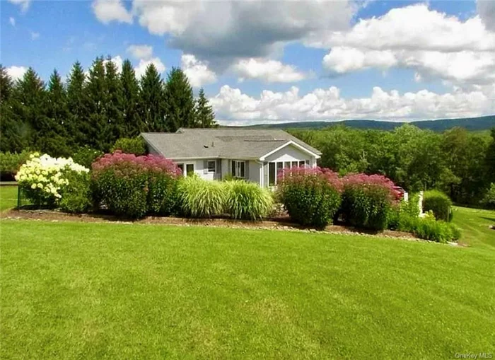 MAJOR PRICE IMPROVEMENT! MOTIVATED SELLER! MAKE AN OFFER! Whether you&rsquo;re looking for a full-time home in the Catskills, the perfect weekend escape or great rental potential, this is it! Enter past the stone pillars and picket fence and up your private drive to this impressive, meticulously maintained home nestled on 3 park-like acres, with award-worthy gardens, apple trees and mountain views. Floor-to-ceiling windows, a rear deck for barbecues and a quintessential front porch offer ample opportunity to appreciate the beauty that surrounds you. The large kitchen has upgraded appliances, and the spacious 4-5 room finished basement with its own entrance, could easily be converted into a 2 apartment. Many upgrades and improvements include attached 2 car garage. Only minutes to Livingston Manor, Roscoe, Callicoon and Bethel Woods Center for the Arts, and only 1hr 40mins from GWB This home has been a very happy place for the current owners and they know it will be for the next ones too!