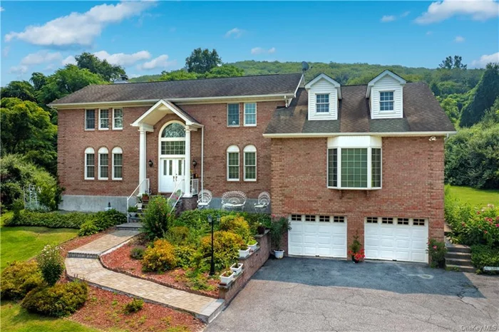 Minutes from the Village of Pawling, this custom built 3-bedroom 3-bathroom Colonial is Perched on 1.5+ acres. Pull up the wandering drive and you will be welcome by the large, tiled entry. To the right you will find a large open, eat-in kitchen with center island, granite countertops and a walk out to the back patio. Through the kitchen you will enter the large formal dining room with hardwood floors, large bay window and ample room for entertaining. Through French doors from the Dining Room or through the kitchen you will enter the Living Room featuring hardwood floors, large windows and sliding glass doors to the patio. To the left of the entry, you will find the sunlight flooded formal living room with hardwood floors, corner fireplace. The main floor also offers a full bath. Up the center stairs you will find the primary suite boasting soaring ceilings, large windows, hardwood floors, walk in closet and a primary bath. Down the hall you will pass a large full bathroom and two additional bedrooms with hardwood floors and large closets. Passing through the left bedroom you will find a large bonus room with carpeted floors, large closets and tons of space! Additionally, there is a full unfinished basement with laundry and a large 2 car garage. Located conveniently near Metro-North, Route 55, Route 22, I684 and I84. A must see!