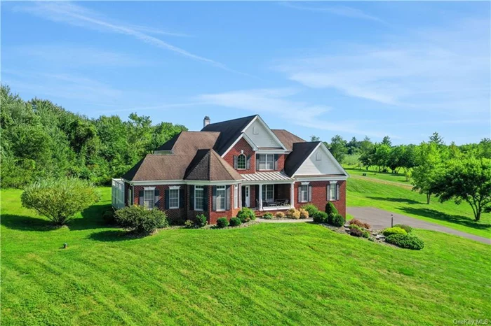 Welcome to 28 Le Fevre Lane, an exquisite custom-built Colonial perched majestically on 2.26 acres, offering breathtaking views of the stunning Shawangunk Ridge. This stately residence is a testament to meticulous care and exceptional craftsmanship, with every detail reflecting pride of ownership. As you approach this beautiful home, you&rsquo;ll immediately notice its commanding presence atop a gentle hill, providing both privacy and sweeping vistas. The open-concept design of this sun-drenched home is enhanced by an abundance of windows and french doors, seamlessly blending indoor and outdoor living spaces. Step inside to a grand foyer that greets you with soaring ceilings and sets the tone for the elegance that lies within. The ground floor boasts a formal sitting room at the front, perfect for welcoming guests. Adjacent to it, the massive formal dining room features intricate trim details, making it ideal for hosting memorable gatherings. The heart of the home is the spacious kitchen, which flows effortlessly into the eat-in kitchen area and the living room with soaring ceilings and centerpiece fireplace. This open layout is perfect for entertaining, allowing for easy interaction with friends and family. A highlight of the main level is the incredible den/office wing, featuring a sunken room with bookcases, offering a cozy and private retreat. The primary bedroom suite on the main level is a sanctuary of comfort, complete with a walk-in closet and a luxurious ensuite bathroom. Upstairs, the second story overlooks the first floor, adding to the home&rsquo;s striking architectural appeal. Here, you&rsquo;ll find three additional bedrooms, including a second bedroom suite with a private bathroom, as well as a third full bathroom with a tub/shower combo. A versatile loft area, currently used as a playroom, adds to the home&rsquo;s flexibility. The dual staircases, one from the front foyer and another from the kitchen area, enhance the home&rsquo;s layout and flow. Additional features include a two-car garage and a massive basement, providing ample storage space. Situated in the highly desirable Le Fevre Lane subdivision, this property is a prime piece of real estate, offering luxury, privacy, and spectacular views. Don&rsquo;t miss the opportunity to make 28 Le Fevre Lane your forever home.