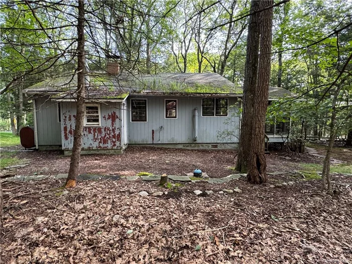 Embrace the lake life with this 3-bedroom home on Wolf Lake! This 1950s &rsquo;camp&rsquo; is bursting with potential, offering you the perfect canvas to create your ideal retreat. While this home needs total renovations, it comes with deeded lake rights, giving you access to the serene waters of Wolfe Lake. Imagine starting your mornings with a peaceful kayak ride, just a short stroll from your front door. Surrounded by the natural beauty and close-knit community of Wolf Lake, this property is your opportunity to transform a classic camp into your dream lakeside getaway!