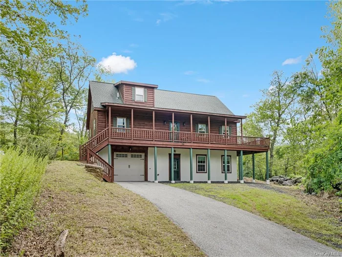 Nestled on 13.8 private acres with stunning mountain views, this impeccably maintained 8-year-old log home offers the perfect blend of rustic charm and modern convenience. The interior is entirely crafted from warm, natural woods, featuring a vaulted ceiling with abundant natural light, a cozy fireplace, and a bedroom and a full bath on each of the three levels. The wrap-around porch provides a relaxing outdoor space to take in the scenic, secluded surroundings. The walkout basement, complete with a full bath, provides excellent options for guests or extended family. This log house exudes a timeless elegance, with the rich textures and character of the wood visible throughout. The property also holds subdivision potential, or an Airbnb opportunity, making it an excellent investment opportunity, while its close proximity to major highways ensures easy access to nearby amenities.