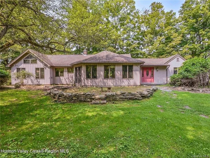 Welcome to 601 Berme Road, a unique, one-story home with over 700 feet of frontage on the beautiful Rondout Creek in High Falls - one of the most charming spots in the Hudson Valley/Catskills Region. Set on seven quiet, private acres, this serene location allows you to not only enjoy a mountain creek that accommodates small craft, fishing, and friends on a hot summer day, but also to live in harmony with birds, wildlife, and ancient, mature trees. The 3 bedroom, 2 bath house has an open floor plan with lots of cubic space. Vaulted, beamed ceilings in the great room and the primary suite (which includes a clever loft) make this home feel much grander and more interesting than a standard ranch - this one is special. The primary suite is at one end of the house, the 2 other bedrooms at the other. The main living space features a woodstove and walls of windows, one of which opens out on a bluestone patio (with a built in barbeque), one of several that surround the house. The sunroom offers a second, gathering space with windows that let the outside in. The greenhouse, shed, and 3-car garage with second-floor loft space offer more than enough storage to include a workshop space, studio space, potting area, etc. There is some deferred maintenance inside the house which is reflected in the price. This stunning waterfront property is worth the work .