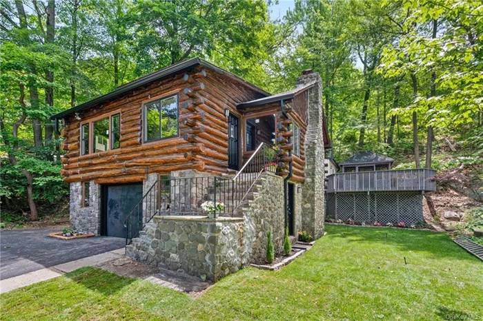 LOG HOME ON THE GREENWOOD LAKE MARINA  RENOVATED!!! Check out this 4 Bedroom, 1.5 Bathroom Log Home nestled in the Forest Knolls subdivision and a stones throw away from the Greenwood Lake Marina. This log home is less than 5 minutes from the New York/New Jersey state border, close to a variety of local shopping, eateries, near parks, schools and close to most major highways including NYS Route 17A and Interstate 87. Amenities include a Kitchen with granite counter tops, stainless steel appliances, exposed wooden beams and knotty pine walls throughout, dining area, office space w/sliding doors, full bath, loft area overlooking the living room w/grand stone fireplace, vaulted ceilings, four sizeable bedrooms, finished basement w/half bathroom, oversized rear deck with gazebo, one car attached garage and just a stones throw away from the Marina. Great for year round residential, short term rental or seasonal living. Don&rsquo;t pass this opportunity by, call now for your showing!!