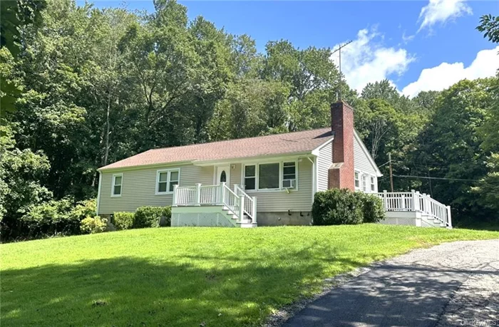 Nestled on a secluded street near the scenic Red Mills Park and Kirk Lake, this charming Ranch home in the sought-after Mahopac School District offers both comfort and convenience. The main level features a beautiful granite kitchen with stainless apliances and a breakfast room, perfect for morning coffee or casual meals. The bright and spacious living room, complete with a picture window and welcoming fireplace, is ideal for relaxing or entertaining. Lovely hardwood floors add elegance throughout the main level, which also includes three spacious bedrooms and a full bath with ceramic tile flooring. Other nice details include recessed lighting and wainscotting. The versatile lower level features a finished family room with another full bath, a convenient laundry area, and direct walk-out access to the backyard, offering endless possibilities for outdoor enjoyment. Amenities include an oversized 2-car attached garage, a Google Nest Smart Thermostat for efficient climate control, and a Ring Doorbell for added security. This home combines classic charm with modern updates  must see! The taxes shown do not yet reflect the STAR deduction, making it even more appealing for those who qualify.