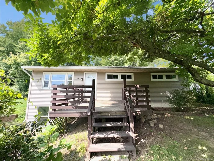 The ranch home at 119 Petticoat Lane in Hurley, NY, enjoys a serene, semi-rural setting amid the scenic Hudson Valley, with rolling hills and lush woodlands surrounding the property. This tranquil environment is complemented by the home&rsquo;s convenient location adjacent to Interstate I-87, offering easy access to major routes and nearby towns.  The ranch-style residence features a classic single-story design with an open floor plan and large windows that frame the picturesque views of the natural landscape. The exterior, likely clad in traditional materials like brick or siding, is set on a spacious lot with room for outdoor activities and gardening.