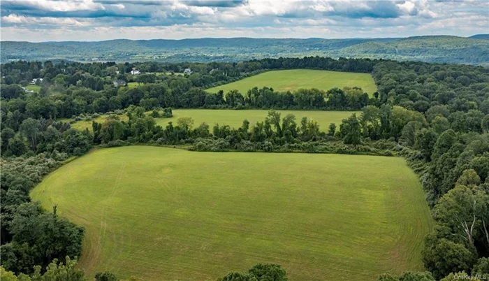 Welcome to 53 acres of stunning land in Patterson, NY. This remarkable property offers a unique opportunity to own a piece of history. Originally part of a border dispute between New York and Connecticut, this land became part of New York in 1731 and shortly thereafter was acquired by one of Quaker Hill&rsquo;s oldest families who farmed it for generations. The parcel is beautifully ringed with mature trees, providing privacy and a peaceful ambiance. The land is divided into three expansive hay fields, separated by narrow tree lines, creating a picturesque and functional landscape. The center of the property is nearly level, with gentle slopes rising to the west and descending to the east, offering an elevation change of approximately 100 feet. With numerous potential homesites, each boasting outstanding views, this land is perfect for those looking to build their dream home. The fertile soil and open fields make it ideal for organic gardening, crops, livestock, equine activities, or outdoor sports. The current Ag exemption in place reduces taxes from $10, 788 to $1, 857. Despite its serene and rural feel, this property is conveniently located just 3 minutes from Thunder Ridge Ski Area, Route 22 with local restaurants and shopping, and only 5 minutes from the Patterson Metro-North station, making it an easy commute to New York City. Don&rsquo;t miss this rare opportunity to own a piece of Quaker Hill&rsquo;s rich history and create your own legacy on this exceptional property. Be sure to click on the virtual tour icon to do a 360 degree panorama tour from four different areas of this incredible parcel!