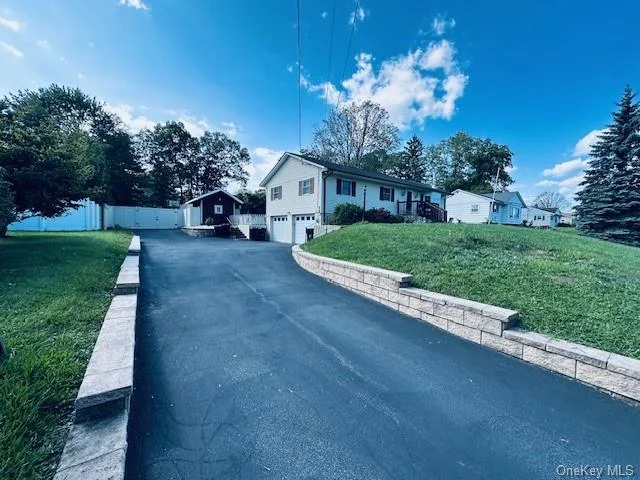 Enjoy one-level living in this beautifully renovated 2016 ranch-style home. The large open concept living room, dining room and kitchen offer plenty of room for everyone to be together, the open floorplan is defined by a beautiful hardwood floor throughout with a wood-burning stove. A large bay window allows lots of natural light to come in. Beautiful, updated Kitchen with granite countertops, tiled backsplash, stainless steel appliances, 5 burner stove, double oven, microwave, double door refrigerator a ton of cabinets and counter space. Central Air. Main bathroom featuring patterned tile floors and tiled shower. Master Bedroom with half bath with tile walls and walk-in closet. A cozy family room offers you a wall-to-wall stone fireplace, two skylights, large windows and hardwood floor. Large two car garage. The wonderful fence in the backyard surrounds an above ground pool, Patio with manual retractable awning wonderful for your summer entertainment. Plenty of parking spaces on long driveway with stone retaining wall.   Situated close to all major highways, shopping centers, restaurants, and schools, you will appreciate the ease of access to everything you need. Embrace a lifestyle where your daily errands and leisurely outings are just moments away. Come and fall in love! It won&rsquo;t last!