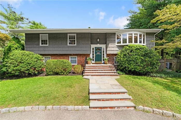 A circular driveway introduces this bright and sunny four-bedroom home. The professionally landscaped setting boasts mature trees, flowering shrubs and beautiful gardens. Vacation at home in your private, fenced in yard offering a wonderful 20x40 inground pool, expansive patio and deck for outdoor enjoyment. As you enter this lovely home, you will appreciate the abundance of space. The main level offers an eat-in kitchen, dining room currently being used as a sitting room, a spacious living room, a primary ensuite bedroom with a huge walk-in closet, two additional bedrooms and a hall bathroom. Enjoy quiet evenings in the spacious family room with fireplace and a door to the patio on the lower level in addition to the convenience of a summer kitchen, a fourth bedroom, a full bathroom, and plenty of storage. Explore all Yorktown has to offer including Wilkens Fruit Farm for apple picking, concerts in town at DeVito Park and the many parks and hiking trails in FDR Park. It is a short drive to the Taconic Parkway, close to schools, shopping and fine restaurants and only one hour to Manhattan. Call for your private showing.