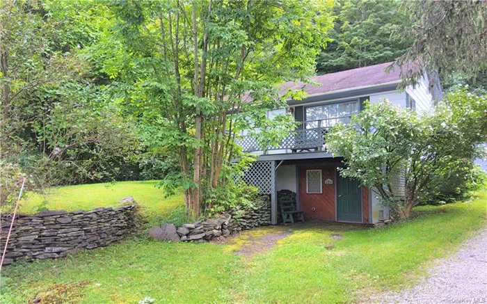 Location Location Location! This charming well-maintained cottage, nestled in the magical Catskill Mountains, is only seven minutes from Belleayre Mountain, an outdoor lover&rsquo;s paradise with skiing, mountain biking, rock climbing, swimming, and hiking right at your fingertips. Belleayre also plays host to a vibrant music scene with events throughout the year. Five minutes away, the quaint village of Margaretville invites you to explore its charming shops, delicious eateries, and a lively arts scene with a local theater and several galleries. Enjoy the soothing sights and sounds of Dry Brook Creek along with beautiful mountain views right across the road from the cottage. The interior features hardwood floors throughout and a bright spacious living room that opens to a large eat-in kitchen. Not included in the official square footage is the semi finished walk-out lower level which adds approx. 448 sq ft of additional flexible space, ideal as a recreation room and third bedroom. Situated walking distance from the quaint town of Arkville, with its cozy mom-and-pop shops and small-town charm. The cottage is also a short drive from world-class fishing at the Pepacton Reservoir and East Branch of the Delaware River. Live here and be right in the middle of everything the Catskill Mountains have to offer. Lovingly maintained for 20 years, this home is ready for new owners looking to relax, unwind, and find adventure whether as a short-term rental or full-time retreat.