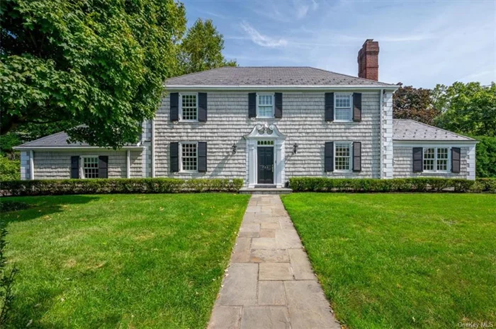 Elegance defines this often admired residence located in Pelham Manor. Boasting 4 bedrooms and 5 bathrooms, this elegant home spans over 3800 square feet on a generous 16988 square foot corner lot, offering ample space for potential pool installation. The exterior exudes stunning curb appeal, featuring hand-dipped cedar shakes and oversized Marvin windows. The gourmet kitchen adorned with Statuario (imported from Italy) marble countertops, high-end appliances and two dishwashers for easy entertaining. The wood burning fireplace w/ handcrafted imported mantle, wall scones and hardwood floors make this home refined. Heated floors in the Primary bathroom, that also has full slab Carrera marble, hall bath, and office/den, make it so very comfortable on chilly mornings. The lush landscaping complements the exterior, creating a picturesque setting for outdoor gatherings. This timeless home offers an opportunity for luxurious living in a highly sought-after Pelham Manor location.