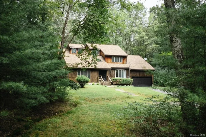 This is your contemporary retreat in Glen Spey, where high ceilings and expansive windows flood the space with natural light, creating an airy, uplifting atmosphere. Secluded far off the road on 3.5 wooded acres, this is the cabin in the woods you&rsquo;ve been looking for. All within an hour and forty minutes to NYC.  Enter through the double doors into the bright foyer. To your left, you&rsquo;ll step down to the living area with large windows and high ceilings. Enjoy the comfort of a spacious, open layout that seamlessly connects the living and dining areas with the kitchen, anchored by a cozy fireplace perfect for unwinding. The downstairs bonus room is currently set up as a bedroom, but would also make a great office or den. Upstairs, the primary suite is accessed though unique double doors and features sky high ceilings with tons of natural light. Down the hall, two additional bedrooms and another bonus room share a bathroom - all of which look out onto the canopy. With total privacy and an attached garage, this home offers the perfect balance of seclusion and convenience.  Outside, the multilevel deck surrounded by evergreens is ideal for those moments when you want to sip your coffee (or wine) and reconnect with nature. It&rsquo;s the perfect setting for your fire pit on those laid back weekends you&rsquo;ve been dreaming of.   Glen Spey offers a rural, wooded landscape that is almost pacific northwest in appearance with lots of evergreens and big open skies, peppered with large lakes and streams across the terrain. A brief drive to hot spots like Narrowsburgh, Bethel, Highland Lake, White Lake, Forestburgh, and Cochecton makes Brightwoods your basecamp to all the hiking, swimming, fishing, concerts, shops, and restaurants that Sullivan County has to offer. This location is ideal as a weekend getaway, co-primary home, or full time residence. Discover a home that feels like your own private oasis, where every detail has been crafted to enhance your living experience.