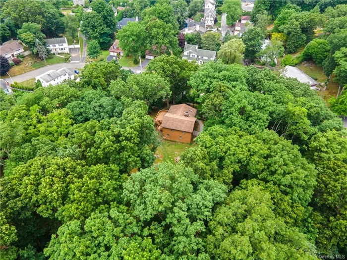 Rare land opportunity! Live in idyllic seclusion on one of the largest lots in lower Westchester while enjoying all the lifestyle advantages of a coveted Historic Hudson River town. This 4 BR, 2 &#189; bath single-family home, nestled among the treetops on 11 wooded acres with sweeping vistas of the valley below, is in Irvington--renowned for its top-performing public and nearby private schools, friendly village vibe, spectacular waterfront parks, and an easy 45-minute commute to Grand Central Station.  The choices and options are yours: renovate the existing home, build a new one, create a family compound, or just move right in and let future plans unfold! The property includes 10 plus acres of undeveloped land extending up the hilltop to the 200-acre Taxter Ridge Nature Preserve, protecting your privacy in perpetuity. This rare combination of convenient village access and complete privacy only 2 miles from Irvington&rsquo;s Metro North Station comes along once-in-a-lifetime. Don&rsquo;t miss out! You will see this property is full of potential!