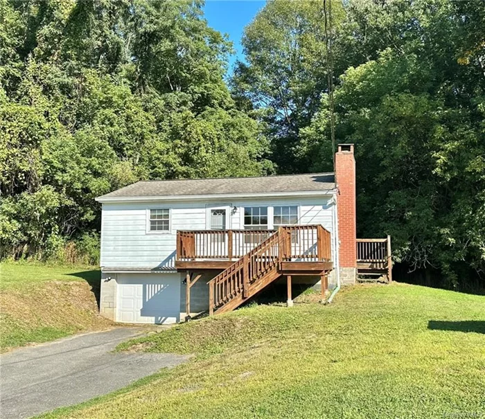 PERFECTLY PRIVATE COTTAGE FOR RENT IN WALLKILL! This adorable home has been freshly painted with hardwood floors and offers a living room filled with natural sunlight, kitchen with eat in area, huge bedroom with a large closet and a full bathroom with access to both the hall and bedroom. Off the kitchen is a laundry area with washer/dryer hook up and shelving for all your pantry needs. Sliding glass doors lead to your private backyard to enjoy the outdoors. There is a side deck right off the kitchen which would be perfect for grilling while the front deck provides an ideal spot to enjoy a cup of coffee or evening meal. This property has an abundance of storage space. The attic has pull down stairs with space to store items. The basement has additional storage area with shelving. There is a one car garage with an remote opener to park your vehicle with additional driveway parking. Landlord is not allowing pets or smoking. Landlord covers garbage, lawn maintenance and snow removal.