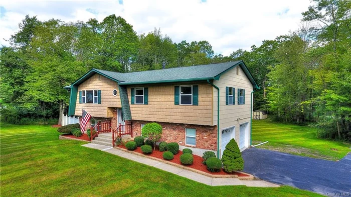 An immaculate 4 bedroom, 3 full bathroom home is now available in Hidden Valley Estates and located within the sought after Minisink School District. As you enter this home you are greeted with wood chair rail and picture frame molding giving this home an elegant touch. Hardwood floors flow throughout the main living area allowing for easy maintenance. The updated kitchen has quartz countertops that allow seating around the countertop and opens into the dining room, perfect for entertaining! The kitchen has a built-in microwave, Monogram dishwasher and Monogram stove & hood as well as soft close cabinets and drawers. From the dining area you can step out onto your oversized wooden deck and admire the level backyard where you can have large gatherings! Three bedrooms and two full bathrooms are on the first level. Glass shower doors are on all bathrooms and tile exists surrounding the tub/shower stalls. Solid wood oak doors exist throughout the home adding a touch of sophistication and durability. Downstairs there is a 4th bedroom with lots of natural light, a family room with a walkout sliding deck door leading to a concrete oversized patio. A full bathroom and wet bar is also on this level! But wait there is more!! A laundry room, utility room (with an on-demand Navian system), Kohler 20kw full house standby generator, two sheds and two car heated garage to park your car year-round can also be found in this home. The property is meticulously manicured and updated with nothing to do but unpack and enjoy!