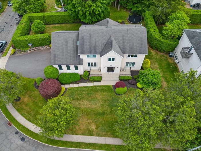 First time on the market! Welcome to this stunning 4, 192 sq/ft fully stucco colonial home, nestled on a beautifully landscaped property. This magnificent 7-bedroom, 4.5-bathroom residence with 9&rsquo; ceilings offers luxurious living with top-of-the-line features. The grand tiled entryway leads to a custom study with built-in shelving, perfect for a home office or library. The oversized dining/living room area, featuring oak wood floors throughout, opens up with pocket doors to a large family room, ideal for gatherings. The eat-in kitchen is equipped with 2 ovens, 2 sinks, granite counters, and a Sub-Zero refrigerator/freezer. An additional kitchen is conveniently located on the main level. A guest suite on the main floor includes an ensuite full bathroom. Upper-level features include 6 additional bedrooms, three fully tiled bathrooms, including a separate guest area. The primary suite boasts an ensuite bathroom with a jacuzzi. A large laundry room with two washer hookups is conveniently located on the upper level. The partially finished walk-out basement has heating and plumbing for a bathroom, with full plans available for finishing to suit your needs. The home is equipped with a full sound system and intercom system. Don&rsquo;t miss the opportunity to own this dream home!