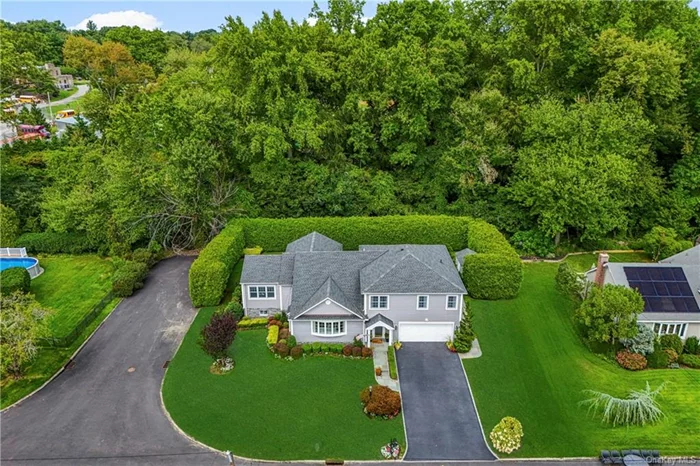 Discover the ultimate in modern living with this sleek, stylish split-level home, meticulously renovated to feel like new construction! Nestled on a level corner lot in coveted Maplewood Park neighborhood, this versatile gem offers unparalleled amenities and exceptional design. Highlights include a chef&rsquo;s eat-in kitchen with custom cabinetry and high-end appliances, a primary suite with walk-in closets, custom built-ins, and luxurious ensuite bath, plus a first floor full bath and bedroom with sliding doors that take you to the patio and fenced-in backyard. Front entry hall welcomes you to the Formal Living Room with vaulted ceiling, gas fireplace and large bay window. Step up to the Kitchen, formal Dining Room with custom wainscot paneling, Family Room and Sun porch overlooking the fantastic backyard and patio with direct line gas grill. The upstairs living quarters include two bedrooms with great closets and a hall bath in addition to the primary suite. Partially finished lower level includes a laundry station, powder room, and amazing storage. Two-car garage is outfitted with mudroom and storage cabinetry. Enjoy the privacy and quiet streets while being close to shopping, schools and access to NYC!