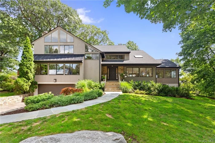 Step inside this stunning Contemporary home that combines modernity and tranquility in the Beechmont neighborhood of New Rochelle. Enjoy an idyllic lifestyle less than a 10 minute walk into downtown Larchmont. This beautifully renovated expansive home offers contemporary flair throughout its three floors. The 1st floor boasts a family room with a wood burning fireplace, a generously sized living and dining room, an updated kitchen equipped with high-end appliances, and a 1st floor bedroom with en-suite bath. The 2nd floor houses the primary bedroom featuring 20 foot ceilings and modern updated en-suite bath with a beautiful skylight. 3 additional bedrooms and a full bathroom complete the 2nd floor. The lower level offers an additional 1600 square feet of space that can be used flexibly. Whether you&rsquo;re seeking a peaceful retreat or a vibrant hub the gorgeous patio is perfect for cozy evenings or outdoor gatherings with family & friends. The lush landscaping adds to the overall appeal of this home. Don&rsquo;t miss your opportunity to live 10 minutes from downtown Larchmont with its fabulous array of restaurants and shops. A short 25 minute ride to NYC makes this a commuter&rsquo;s dream.