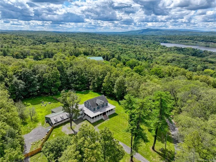 Income-generating Multi-Unit Property  The Jewel House, Rustic Family Retreat, & Carney Cottage in Ulster Park NY. Nestled in the picturesque Hudson Valley, this recently renovated multi-unit property in Ulster Park, NY combines modern luxury with timeless charm across three stunning residences. The property features The Jewel House, a grand 5, 463 sq ft masterpiece; The Rustic Family Retreat, a warm and inviting 2, 291 sq. ft. home; and Carney Cottage, a charming 941 sq. ft. abode. Perfectly positioned near the vibrant towns of Kingston, New Paltz, and Rosendale, and just minutes from world-class destinations such as the renowned Mohonk Mountain House, this property is a gateway to the best of the Hudson Valley. Whether enjoying nearby hiking trails, skiing, boating on the Hudson River, or exploring the local arts and cultural scene, the location offers a harmonious blend of outdoor adventure and small-town charm. The Trex wrap-around deck provides a seamless indoor-outdoor experience.