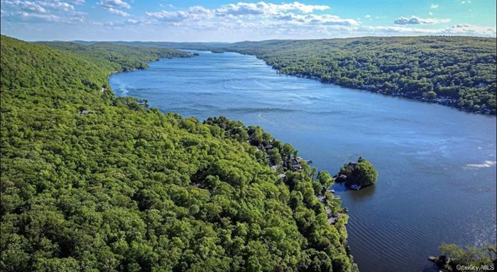 Exclusive Waterfront Investment: Renovated Two-Family Home with Brand New Upgraded Septic System in Greenwood Lake  Discover this unique investment opportunity with a fully renovated two-family home on the serene shores of Greenwood Lake. Each modern unit features 2 bedrooms and 1 bath.  Key highlights include a private dock, offering exclusive waterfront access, bring your boat and enjoy the lake! This property is ideal for short-term rentals like Airbnb, promising excellent return on investment due to high demand in this sought-after location.  Greenwood Lake combines natural beauty with convenience, ensuring strong rental demand and long-term value growth. Enhance your portfolio with this exceptional property, where lakeside living meets lucrative investment potential. An Airbnb income potential report is available upon request.  Seize this chance to invest in a property that offers both financial rewards and the tranquility of waterfront living.