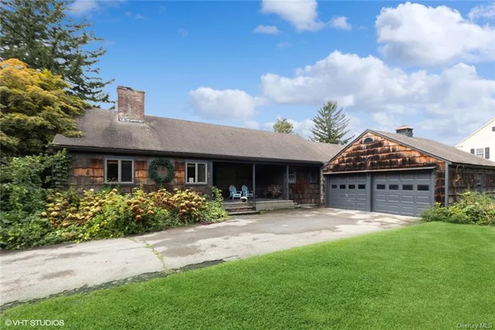 A rare find! Charming two bedroom, one and half bath ranch style home, on half an acre in the Village of Cold Spring, with 360 degree views of the Hudson Highlands. Enter home through the welcoming front porch, surrounded by hydrangeas, perfect for that morning cup of coffee, watching the sunrise. This home boasts mid century flair with its open floor plan, fun Orla Kiely textile wallpaper, Donald Kaufman color palette throughout, and custom mono stringer maple block staircase with Mylen steel balusters. Spacious living room with wood-burning Heatilator fireplace, handsome mantel, original built-in shelves, and picture window overlooking expansive yard with organic garden, patio, and beautiful chemical free in-ground pool with Ipe wood decking. Stunning level yard surrounded by Japanese maples, Russian sage, white cedar, hemlock and ornamental grasses. Open dining room with oversized French sliding doors leads to a screened porch for relaxing with a book, afternoon naps, al fresco dining, or taking in the Hudson Valley sunsets. Bright kitchen with induction stove top, double oven, commercial refrigerator and freezer, butcher block countertops and plenty of cabinets for storage. This home boasts two generously sized bedrooms and a flex space perfect for a den, guest area, or office. Full bathroom with Duravit double sinks, penny mosaic tiled walls, custom lighting, wet room with soaking tub, and private toilet room. Additional powder room also with Duravit sink and toilet. The lower level offers an additional 1, 000 square feet with fitness / recreation area, studio space, and laundry room with sink. Hardwood floors throughout. Whole house water filtration system. Two car garage. Perfect location with steps to hiking at Bull Hill / Hudson Highlands State Park Preserve, Little Stony Point, the Hudson River, West Point Foundry Preserve,  Main Street&rsquo;s restaurants and shops, and Metro North for easy access to NYC.