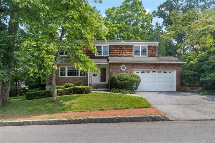 This classic colonial is welcoming and ready for you to move right into. Conveniently located on a tranquil street in prestigious Old Edgemont, it is just a short walk to schools, Scarsdale village, shops/restaurants and train station. With its spacious rooms and modern amenities it offers the perfect blend of comfort and style. The inviting foyer leads into a light filled living room with a wood burning fireplace. The modern kitchen and the family room each has a door to the patio. A formal dining room, laundry room and powder room complete the first floor. The second floor boasts a generous master bedroom suite, 3 additional bedrooms and a hall bathroom. The partial, finished basement includes an additional family/recreational room and utilities. The house features beautiful hardwood floors, 2 zone central air/heat and a 2 car garage. The outdoor space includes a large brick patio and a spacious grassy side yard. Don&rsquo;t miss this opportunity to settle into this beautiful property.