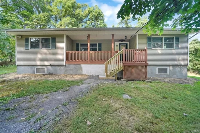 Welcome to this beautifully maintained 3-bedroom, 2-bathroom ranch-style home in New Windsor, within the Cornwall school district. Situated on over an acre of land the home features a welcoming covered front porch, perfect for relaxing in the peaceful surroundings. Step inside to an expansive living area with gleaming hardwood floors, large windows, and a sliding glass door that opens to a large deck! The open floor plan provides plenty of space for both living and dining. Master bedroom features an en-suite bathroom! Minutes to 5-corners and the highway! Solar panels for electricity savings! Schedule your showing today!