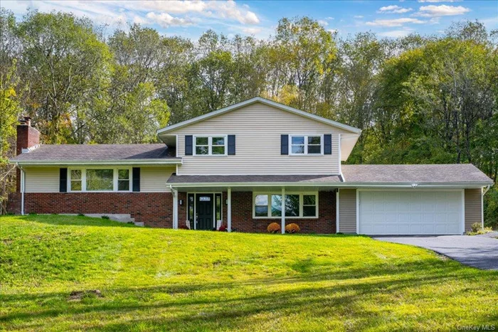 OPEN HOUSE on Saturday, November 9th from 12pm - 2pm.   Come home to the tranquility of this fully renovated Contemporary home tucked into Crum Elbow Road in historic Hyde Park, NY. Conveniently located close to shops, Route 9, Rhinebeck and the beautiful Hudson River. The serene location, large property and open concept floor plan are all exceptionally desirable. Renovated with a modern aesthetic, this 3 Bedroom, 3 Bath, 2612 sq ft home lives like a 4 bedroom on 1.5 acres with a Formal Living Room, Home Office and Finished Basement. Large Two Car Garage. The Deck overlooks a large flat backyard with great potential. The Electrical, Plumbing, HVAC and Water Purification systems are all completely brand new as of September 2024. New Bright-White Shaker Cabinets line the Kitchen with all new Stainless-Steel Appliances and a Large Central Island, topped with Quartz Countertops. New Luxury Vinyl Plank Flooring lines the home, except for the new Tile in all 3 Bathrooms. Washer/Dryer included.