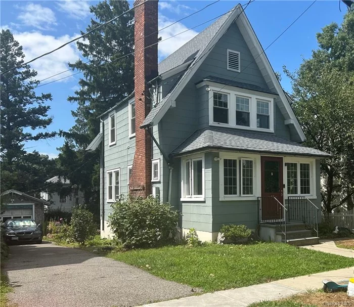 Welcome home to 49 Lawrence! Picture yourself living in the village of Tuckahoe with all of the conveniences Eastchester has to offer. Walk in and be greeted by a charming sun room that flows into the living room that features beautifully maintained parquet wood flooring, and a wood burning fire place. Many dinners to be had in an open concept kitchen/dining area great for entertaining. You will Find three bedrooms and one bathroom upstairs. The fully finished basement has washer/dryer and walks out to side yard. This home is located within walking distance to Metro North, Schools, shops.