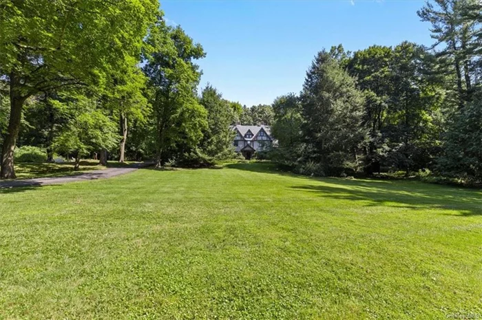 Located on one of the most coveted and scenic roads in Bedford is The Woodpile, five homes built by the Wood family in the 19th and early 20th centuries. Airlie, the final addition to this historic quintet, was built in 1903 in the Tudor Revival style. With a long, tree-lined driveway winding up the four, parklike acres, you&rsquo;ll be captivated by its rich history and stately presence. Replete with exquisite period details, the rooms are all beautifully proportioned with high ceilings, large closets and ample storage areas throughout. Most of the original features remain intact, exuding character and elegance at every turn. This sophisticated, timeless home offers a unique opportunity to create your own extraordinary residence for today&rsquo;s living. The house boasts an impressive 4, 600 square feet of living space, featuring 7 bedrooms and 4.5 bathrooms. Airlie is one of the few remaining houses in Westchester with so much original, period detail still intact: five working fireplaces - two with magnificent marble mantels; four porches, including a sleeping porch; 48 wide paned windows, all of the original hardware, fir floors throughout (oak on the interior steps), original fixtures and penny tile in some of the bathrooms, chair and ceiling mouldings, Dutch doors, plaster walls, sconces  and much more. Airlie offers the rare opportunity to restore and update one of Bedford&rsquo;s most iconic properties.Located just a stone&rsquo;s throw away from the vibrant and highly sought after communities of Mount Kisco, Bedford and Katonah, this home provides easy access to local amenities and a quick drive or train ride to NYC via nearby highways and Metro-North Railroad. Experience the best of both worlds  bucolic, private living with the perks of city accessibility. Don&rsquo;t miss this opportunity to own a piece of history in one of Bedfords foremost estate areas and make 712 croton lake home a part of your history.