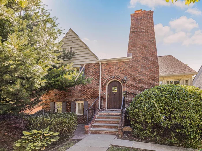 Picturesque storybook staggered Tudor in the Huntswood section of Mount Vernon bordering Bronxville. This lovely home features est. 2, 000 sq ft over 3 levels. Entry foyer up to large living room with W/B fireplace, formal dining room w/ french doors to deck, updated eat-in kitchen with SS appliances, granite countertops and door to deck and backyard; up to level 2 primary bedroom, renovated full hall bath, bedroom #2; up to level 3 - bedroom #3, renovated full hall bath, bedroom #4, step up to walk in attic/storage. Extra large open basement has utility/laundry area and door to tandem 2 car garage. New back deck is partially covered - perfect for morning coffee. Updates include 2 zone central A/C, roof (4 years old), and Trex Deck (1 year old). Conveniently located near schools, parks, transporation, highways, 1 mile to Fleetwood Metro North Station. Taxes do not reflect STAR discount of $1, 748. Bring your finishing touches to make this your home sweet home! Shown by appointment.