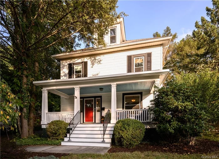 Timeless elegance and outdoor living on an oversized lot! Nestled on a hill, this stately American Foursquare exudes vintage charm and character. Step onto the large, inviting front porch and enter through the stunning stained glass front door, where you&rsquo;ll be welcomed by period woodwork and doors adorned with crystal knobs. The home boasts tall 9-foot ceilings and gleaming hardwood floors throughout most rooms, as well as an abundance of natural light from large windows. The spacious entryway greets you with old world charm and has a large closet and stylish powder room tucked beneath the home&rsquo;s double staircase. Beyond the entryway are two living rooms, separated by double pocket doors, offering flexibility and great flow. The front living room leads into the rear, which features a beautiful corner wood-burning fireplace with built-in storage on one side and a pair of recessed cabinets with stained glass doors above the mantel. This room also includes a large box bay window and direct access to the back porch and rear yard. The formal dining room is a showstopper, showcasing another large box bay window, a built-in buffet with leaded glass cabinetry, a wraparound plate rail, and convenient rear access to the staircase. The adjoining butler&rsquo;s pantry provides extra storage, a second freezer, and an appliance garage, leading into the eat-in kitchen with neutral wood cabinetry, stainless steel appliances, a bay window, and another door that opens to the back porch and rear yard. Step outside into a level rear yard an entertainer&rsquo;s dream! Added during the past four years, a large bluestone patio, custom 6-foot white cedar fencing, an elegant arbor, and beautiful plantings provide plenty of space for gatherings and additional privacy. The detached one-car garage includes an attic/loft for additional storage. Upstairs, are four generously sized bedrooms, each with ample closet space, and a full bathroom. Two of the bedrooms could easily serve as the primary bedroom. One of these bedrooms leads to the home&rsquo;s crowning feature an 20-foot-wide covered second-floor porch, perfect for morning coffee, private outdoor dining, or a relaxing retreat with views of the yard below. The unfinished walk-up attic offers endless potential, with dormered windows, a cedar closet, and plenty of space. Centrally located in a walkable neighborhood, this vintage beauty is just minutes from shopping, schools, the train station, and more!