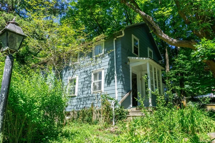 A quaint antique home the hamlet ofGallatinville, NY. This 1820 home on .68 acres is loaded with quirky charm. With vintage wallpaper, lots of built-in cabinets and bookshelves, the 3-bedroom 1-bath house is as homey as they get. From the glassed-in porch, you step into a cozy entry hall, then into a large dining room. The country kitchen and comfortable living room with wood burning fireplace insert are off the dining room, and the bathroom is on the ground floor too. Upstairs are three bedrooms and a sitting area that can be converted to a bath or furnished as a library or study. In the shade of the trees surrounding the house are a patio, an old root cellar, a stone barbecue and a raised bed vegetable garden. A two-car garage is tucked into the hillside and there&rsquo;s ample parking for additional cars. Once lovingly landscaped, the property has been little-used for a couple of years, but a little care will bring the gardens back to life. Come check it out!