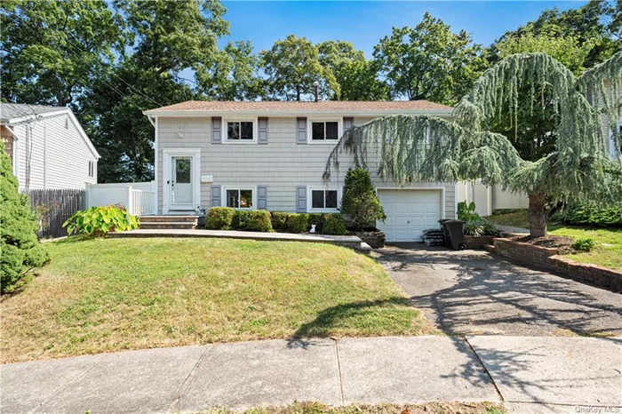 Welcome to 30 Penny Drive. A Charming 3-bedroom, 2-bathroom Hi-Ranch style home in Huntington Station, NY. The first Level features the kitchen, additional living area and full bathroom. On the second floor you fill find a large living room with hardwood floors throughout, 3 bedrooms and another full bath. The home sits on a well-maintained lot with a fenced backyard, ideal for outdoor gatherings. Conveniently located near schools, shopping, and public transportation, this home offers both comfort and convenience in a quiet, suburban neighborhood. The sale of this home is being sold as-is.