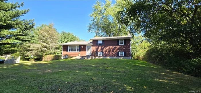 Come see this 3 bedroom, 1.5 bath home on 2.6 acres with Wallkill Schools. Home features 3 levels of living space with your kitchen, living room and dining area on main level. Second level has 3 bedrooms and 1 full bathroom and one half bathroom. Lower level offers a family room or recreational area with a beautiful fieldstone dry bar and a wood fireplace and laundry area. Basement offers ample storage and workshop. Hardwood floors throughout the main level and second level of the home. Three season room overlooks backyard. Most of home is original with some updates throughout.