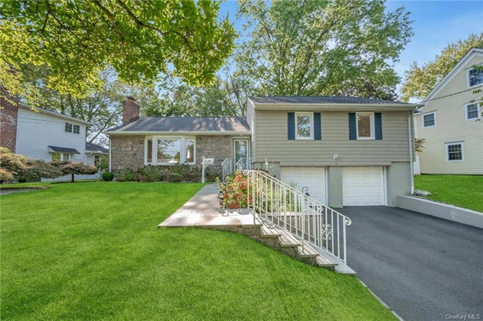 Nestled on a picturesque, tree-lined street, 13 Harvard invites you to experience a perfect blend of comfort and style. The bright, open floor plan is ideal for everyday living and entertaining. The formal living room, with a wood-burning fireplace and large bay window, creates a cozy yet elegant space. The family room offers additional relaxation, with sliding doors leading to a spacious deck, perfect for outdoor enjoyment. The eat-in kitchen boasts stainless steel appliances, a generous pantry, and access to the deck, while a formal dining room completes the main level.  A few steps up, you&rsquo;ll find the primary suite featuring a newly renovated bathroom, two additional bedrooms filled with natural light, and an updated hall bath. A few steps down from the main level is a versatile playroom/office with direct entry to the attached two-car garage. The private, flat backyard offers seamless indoor-outdoor living.  Additional highlights include 546 sq. ft. of finished storage space in the lower level and updates such as a furnace and central air, baseboard heat boiler, and roof. Conveniently located just two blocks from the commuter bus to Scarsdale Train Station and one block from Davis Elementary School.