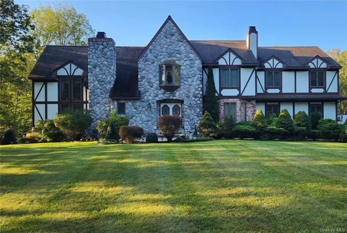 Welcome to this immaculate 4+bedroom, 2-1/2 bath tudor estate with 4, 000+ sq.ft. of living and entertaining space. This must-see Town of Shawangunk property is set on 2.5 impressive, landscaped acres and offers a spacious interior layout, rich with original details. Add your personal touch to the generous living room w marble fireplace, cathedral ceilings, plush carpet, and floor-to-ceiling picturesque windows. An eat-in-kitchen provides ample cabinet space and the formal dining room is the perfect setting for dinner parties. Walk-out to the private oversized deck and observe the Hudson Valley seasons. The family room with hardwood floors is a comfy retreat for watching television or reading your favorite book. A laundry room is located conveniently on the main level. The upstairs balcony that overlooks the living room provides wonderful photo opportunities for your family&rsquo;s cherished memories. An oversized Master Bedroom en-suite has a walk-in closet, double sink bathroom, dressing area, and an additional private sitting/TV room. Three additional bedrooms are thoughtfully designed for space, have double closets with mirrors, and plush carpet. The lower level with an exterior entrance and bathroom offers many possibilities. The additional room can be used as a private office. There is room to create your customized gym or living space. Don&rsquo;t miss the chance to take in all that this one-of-a-kind property offers the discerning homeowner. Call today to schedule your showing and envision the lifestyle this home can offer!