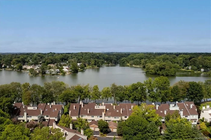 Home Sweet Waterfront Home  full waterviews of Lake Innisfree in the gated, guarded, quiet community of the Townhouses at Lake Isle in Eastchester, NY. Walking paths, a new children&rsquo;s playground, kayak, boat and swim docks, lakefront grills and lounging areas encourage a healthy lifestyle. Security is a top priority at TALI with 24 hour guardhouse monitoring, and concierge service, This townhouse has a beautiful, new modern Eat In Kitchen (2019), 2 New Full bathrooms (2020), Hardwood Floors (2012), Central Vac System (2019), new decks, a new roof (2016), three bedrooms, 2 1/2 baths, laundry room, Elevator, many closets, great storage, HVAC and Hot Water heater in 2013, All 3 Sliding glass doors were replaced in 2017. The garage has a high ceiling, plenty of storage & parking space - plus driveway parking. Landscaping & snow removal make living here even easier & more special. Welcome to Your Home Sweet Waterfront Home.