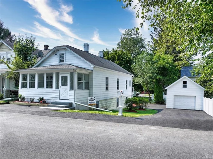 Adorable ranch completely redone is a must see. Features include all new windows, sheetrock, kitchen, half bath, floors, new deck, finished basement with egress windows and walk out. Main floor includes a bedroom and office space as well as a closed in 3 season front porch. Downstairs there are 2 large bedrooms, half bath, laundry, family room and flex area that can be used as an office or den. The heating was switched to gas heat from oil. Brand new furnace and water heater, new electric added as well. There is a large detached garage completely redone. New siding, garage door and flooring with tons of storage. New blacktop driveway with room for ample parking.