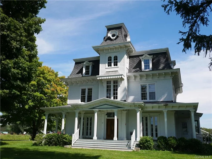 Discover the historic charm of 14 Linden Farm Lane, a stately mansion built in 1875. This grand and gracious residence offers a unique opportunity for its next generation to update and modernize; unlocking its full potential. The home&rsquo;s Second Empire architecture greets you from the moment you arrive, with a tree-lined drive leading to its signature mansard roof and intricate bracketed cornices. A central rectangular tower adds to the distinguished exterior, recalling the sophistication of its era. Step through the original double front doors into living spaces flooded with natural light, thanks to oversized windows that frame stunning views of surrounding farmland. Period details abound, including intricate moldings, hardwood floors, marble fireplaces, and French doors, all of which are well-preserved. The kitchen and two full bathrooms, while fully functional, are ready for updates to make this extraordinary period home contemporary. A grand staircase leads to the second floor, where three bedrooms offer comfortable, spacious retreats. Here, too, natural light flows through large windows. There&rsquo;s a reading nook on the landing and even the wide corridor offers a spot to sit and enjoy the view. The third story, an untouched time capsule from the late 19th century, features five bedrooms with original wallpaper, period lighting fixtures, and marble sinks in each room. This level has never been renovated, presenting a rare opportunity for restoration enthusiasts to preserve or modernize as desired. A staircase leading to the cupola with 360-degree views tops it all off. Outside, a wrap-around porch envelops the home on three sides, providing a tranquil space to take in the views of the expansive grounds and farmlands beyond. 14 Linden Farm Lane is a remarkable piece of history, blending historic elegance with endless potential. With a little care and creativity, this home could be transformed into a masterpiece that preserves the best of its past while embracing modern living.