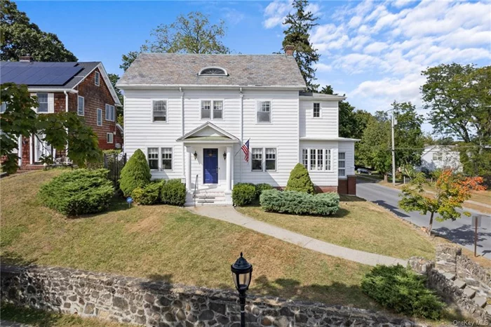 Curb appeal! On a tree-lined street with iron gas lamps, step into the timeless elegance of this 1930 center-hall colonial, a mile from Vassar College, in one of the City of Poughkeepsie&rsquo;s most desirable neighborhoods. Perched on a hill, this 4 bedroom, 2.5 bathroom beauty has a classic slate roof, hardwood floors, made-to-order moldings and numerous double doors that permeate vintage charm. Enter through a stunning portico that sets the elegant tone and the spacious living room boasts a cozy fireplace perfect for gatherings or quiet evenings. The three-season enclosed room offers a tranquil space for relaxation or a home office. An additional formal den provides a private workspace. Upstairs, primary bedroom has dressing room. Outside, the manicured front yard enhances the home&rsquo;s stately appearance. Conveniently located near shops, restaurants and a five-minute drive to the PK Train Station, this home offers historic charm and modern convenience in a beautiful part of the city.